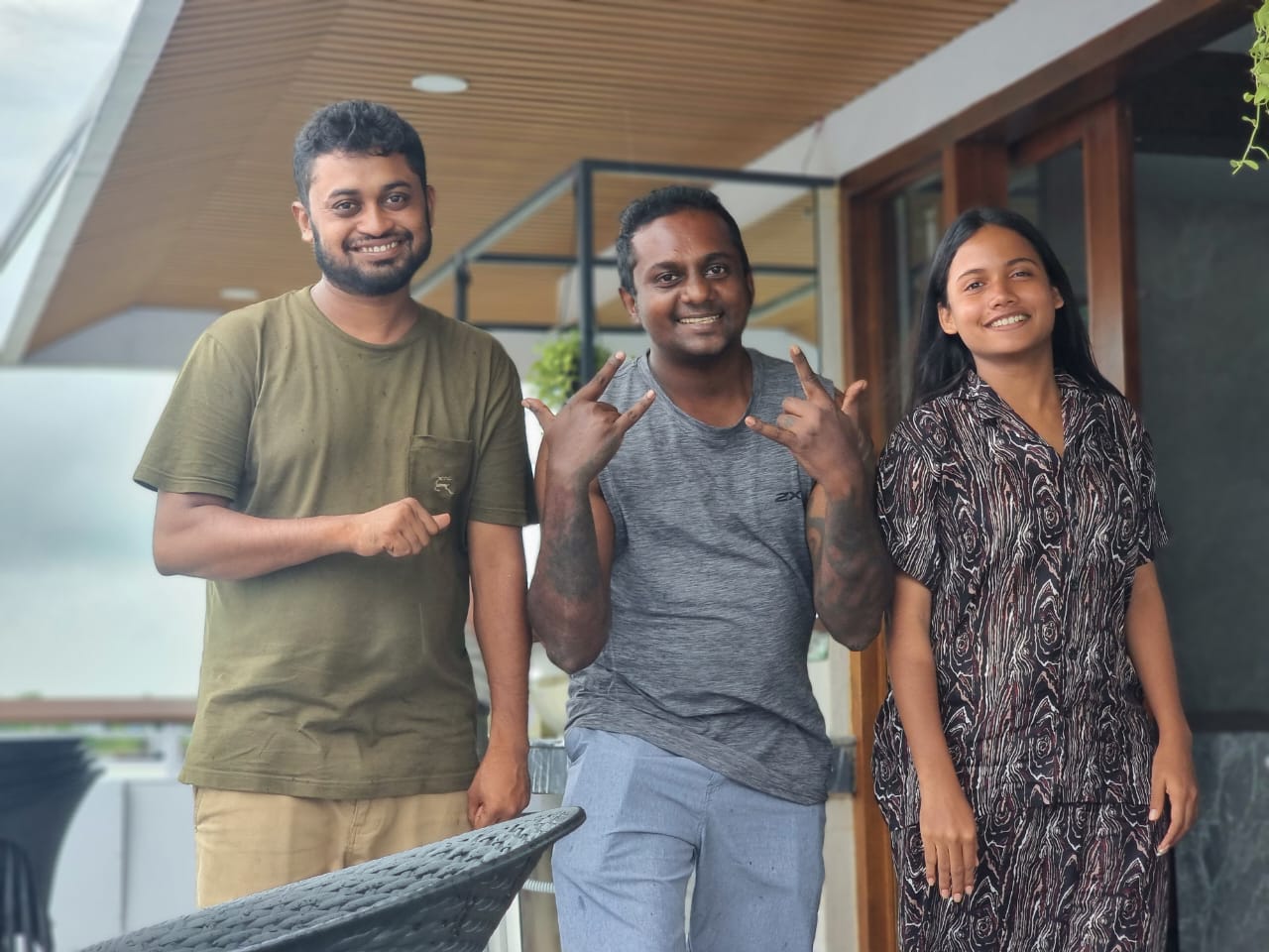 Happy group of foreign travelers at a Sundarban eco-resort with their guide