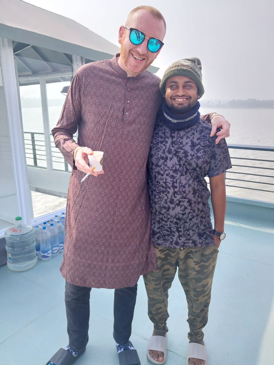 Al Amin guiding international tourists on a serene Sundarban beach during a wildlife safari